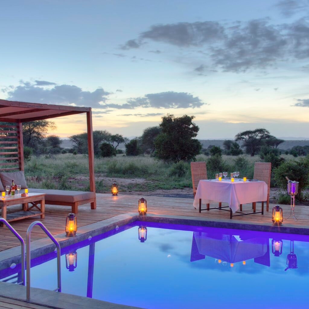 Safari lodge pool at sunset on a Tanzania honeymoon safari